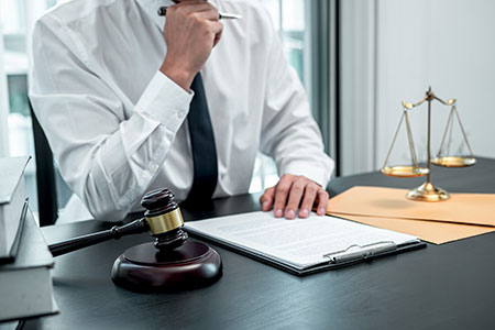 Lawyer sitting at desk.