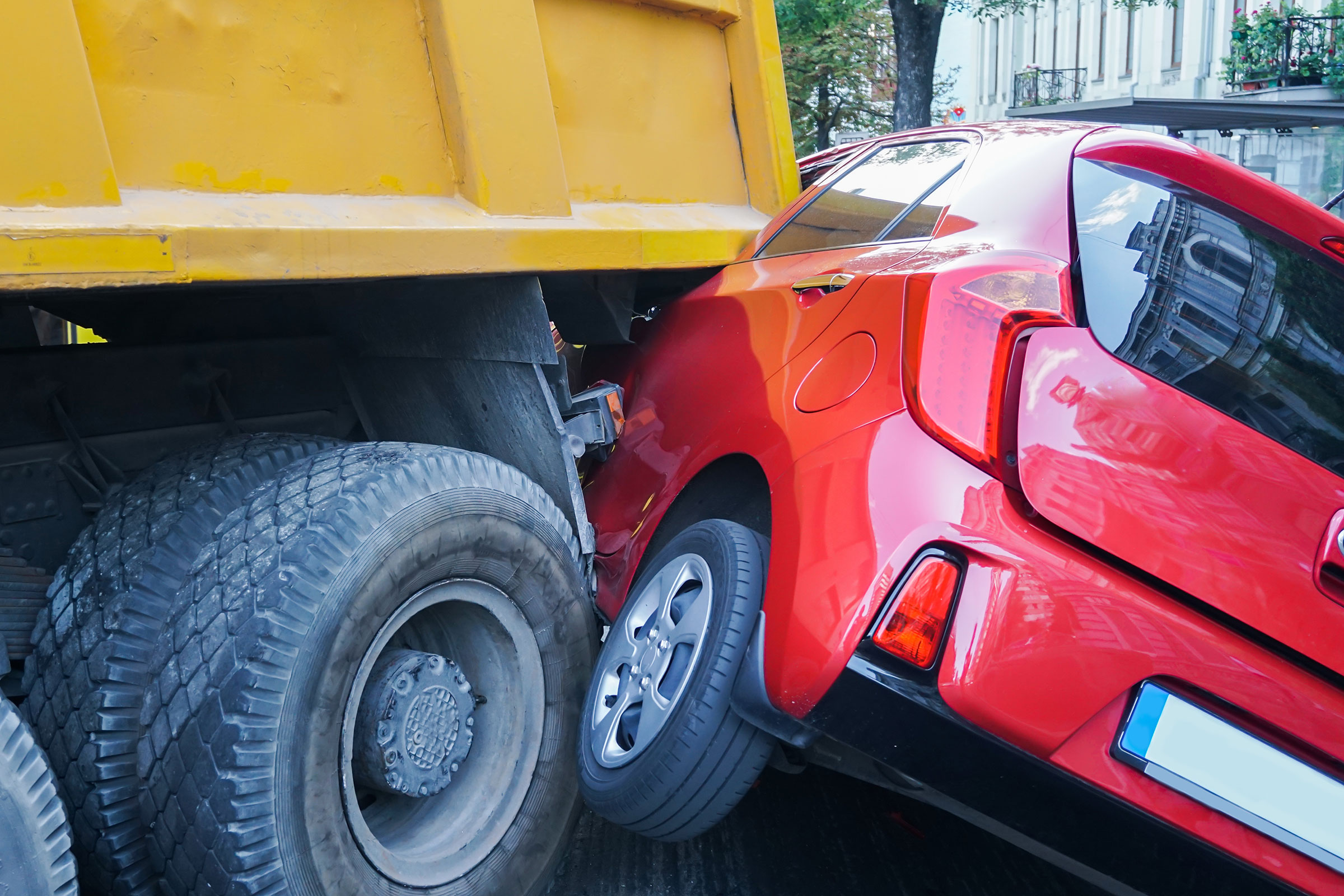 Dump truck accident with car.