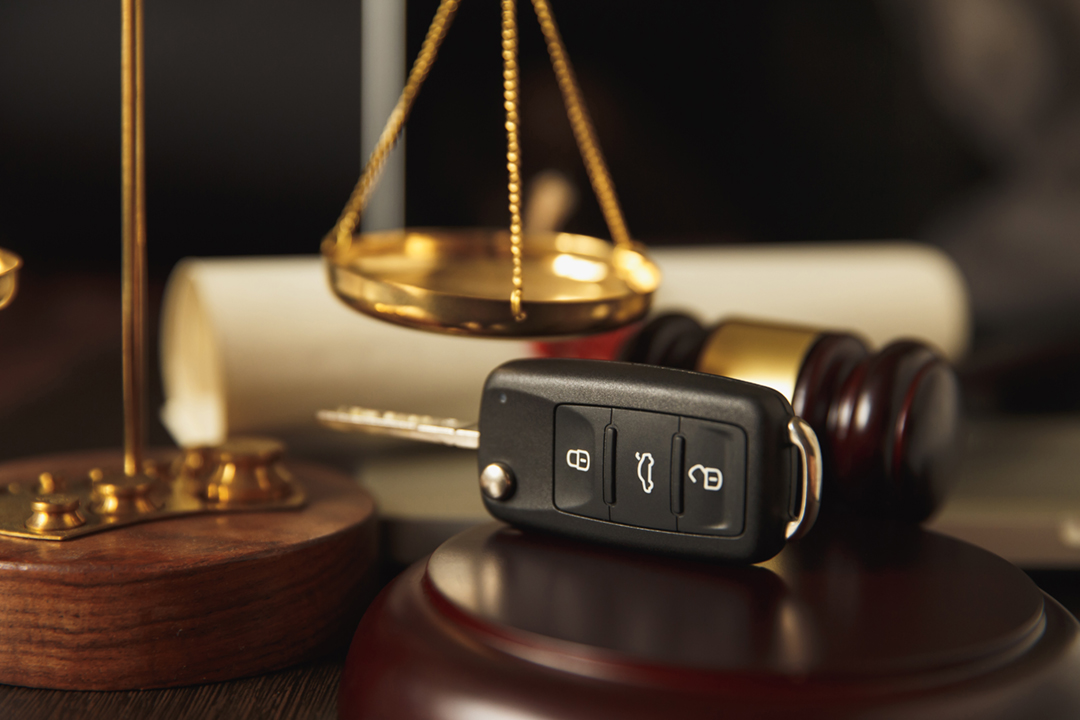 Close Up Of Judge Gavel And Car fob