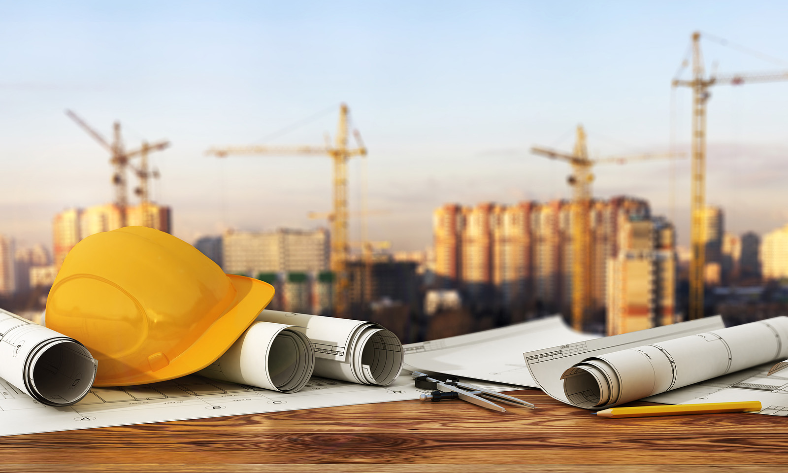 construcion site concept with blueprints and designer tools