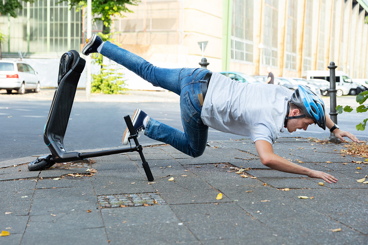 https://www.flinjuryfirm.com/personal-injury-lawyers/images/Orlando-Florida/man-falling-from-scooter-after-hitting-hole.jpg