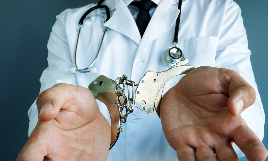 orlando medical malpractice lawyers showing doctor in handcuffs