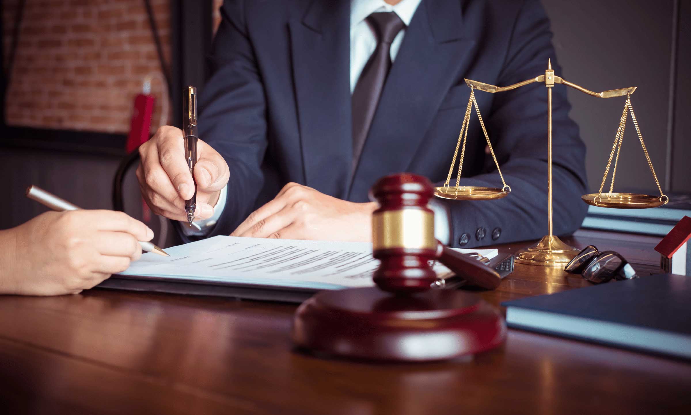 amusement park accident lawyers at desk with paperwork