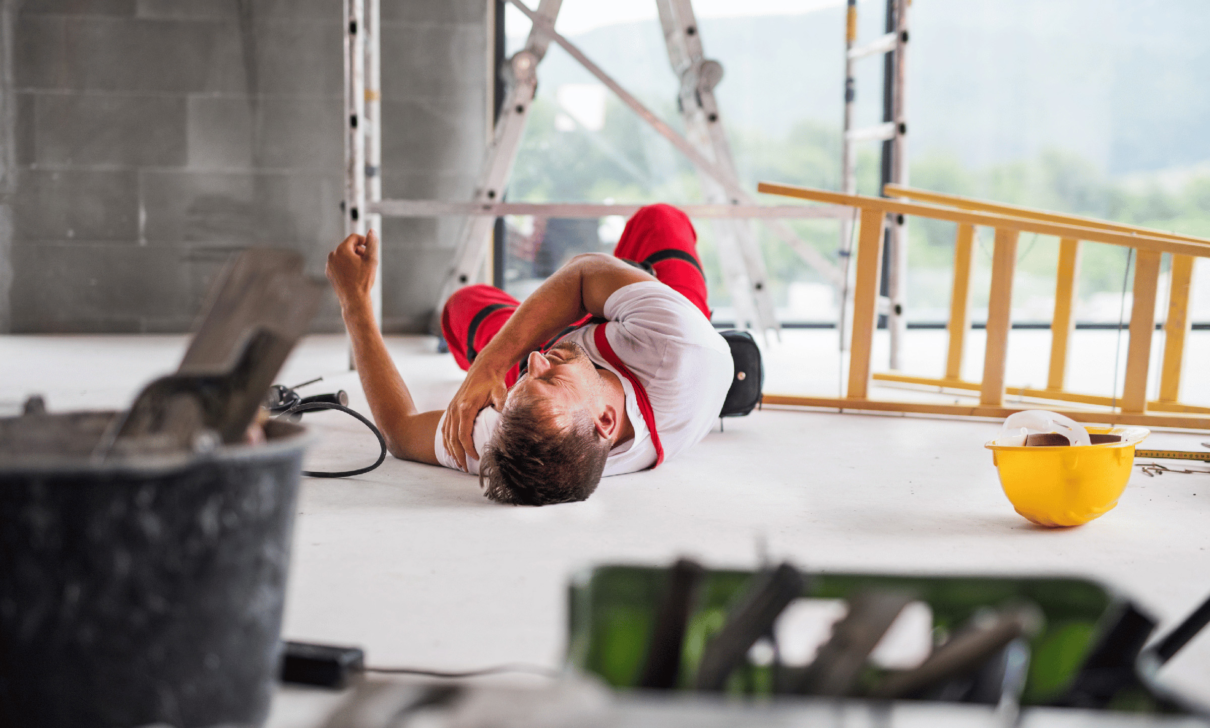 construction worker laying on floor hit by falling object