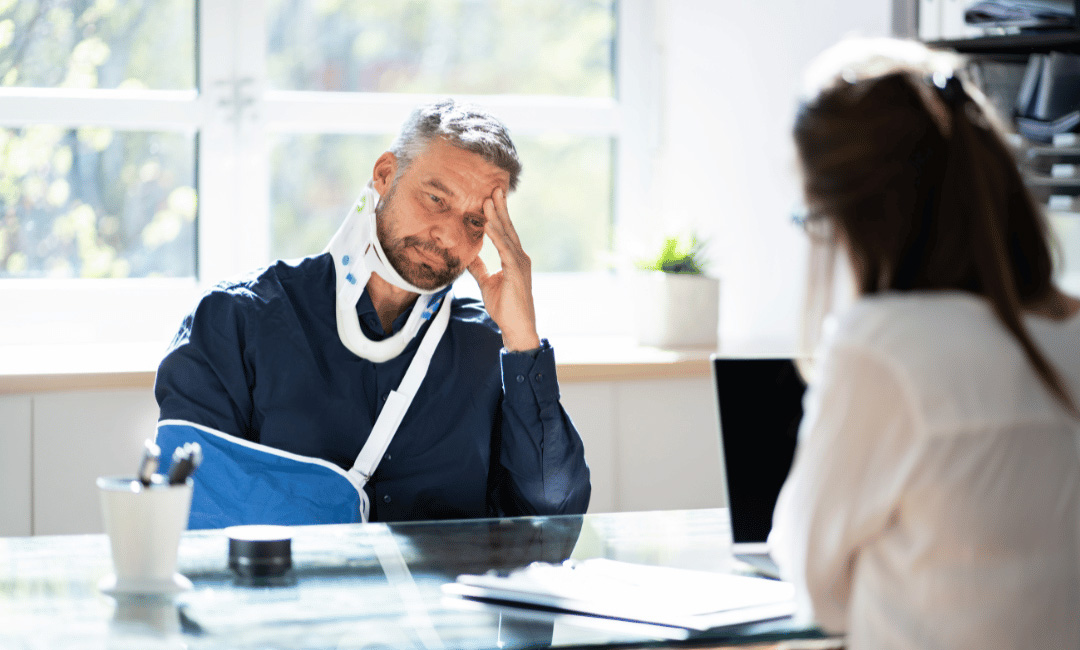 injured construction worker talking with construction accident lawyer