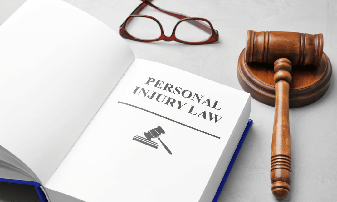 personal injury law book and court gavel
