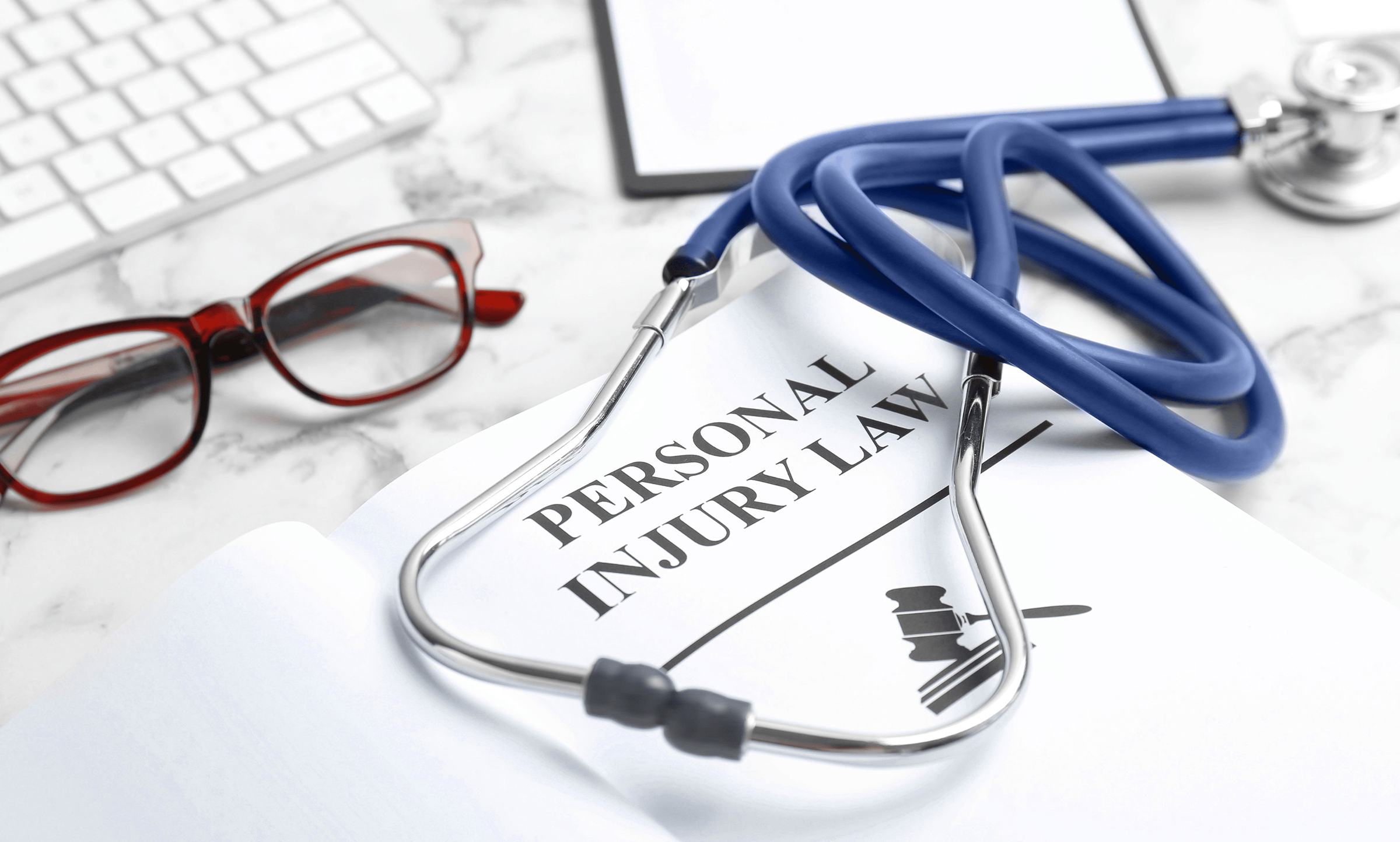 west palm beach personal injury attorneys law book and stethescope