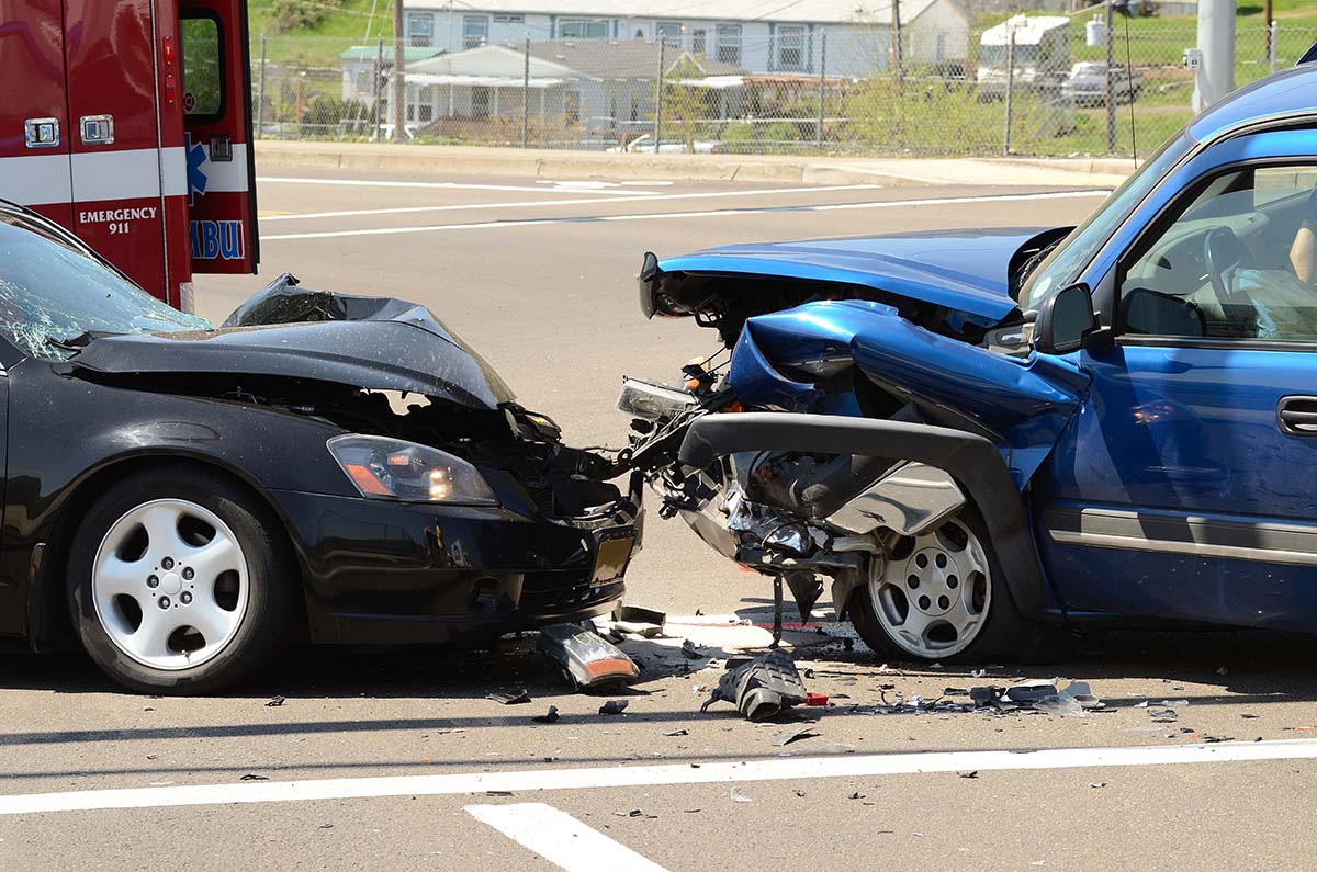Two cars involved in front end collision.