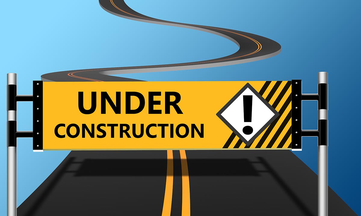 image - Under Construction graphic of sign blocking both highway lanes