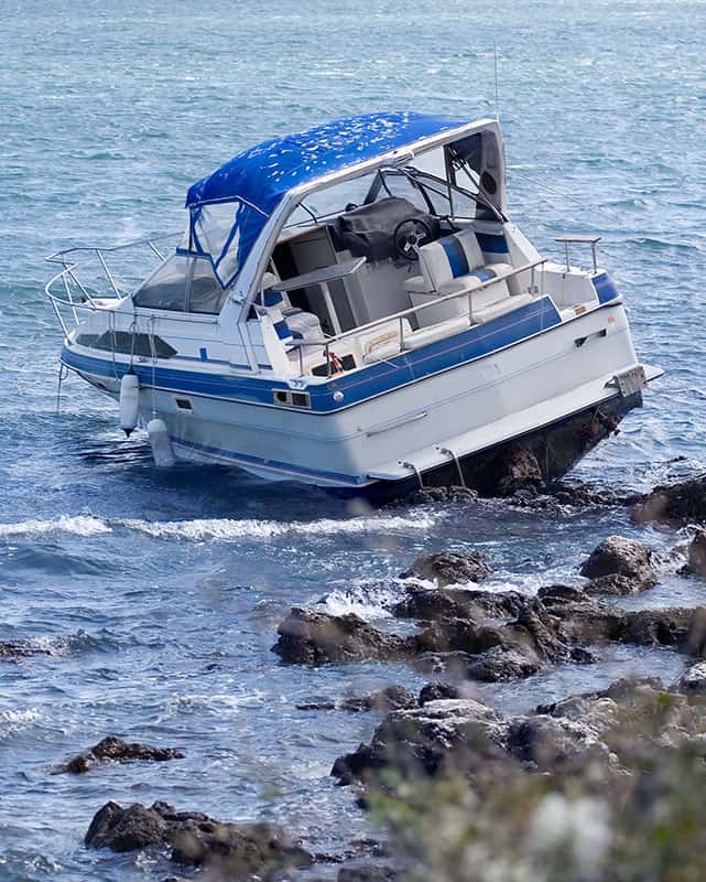 Image -  boat crash on rocky jetty