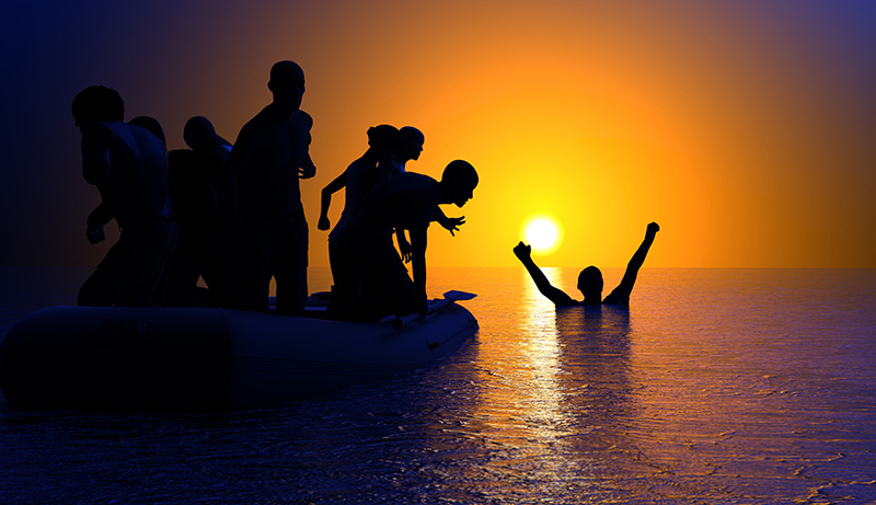 boating accident people in water at sunset l