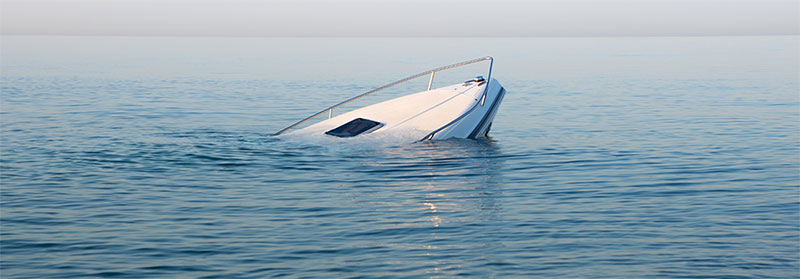 sinking modern large white boat in the ocean