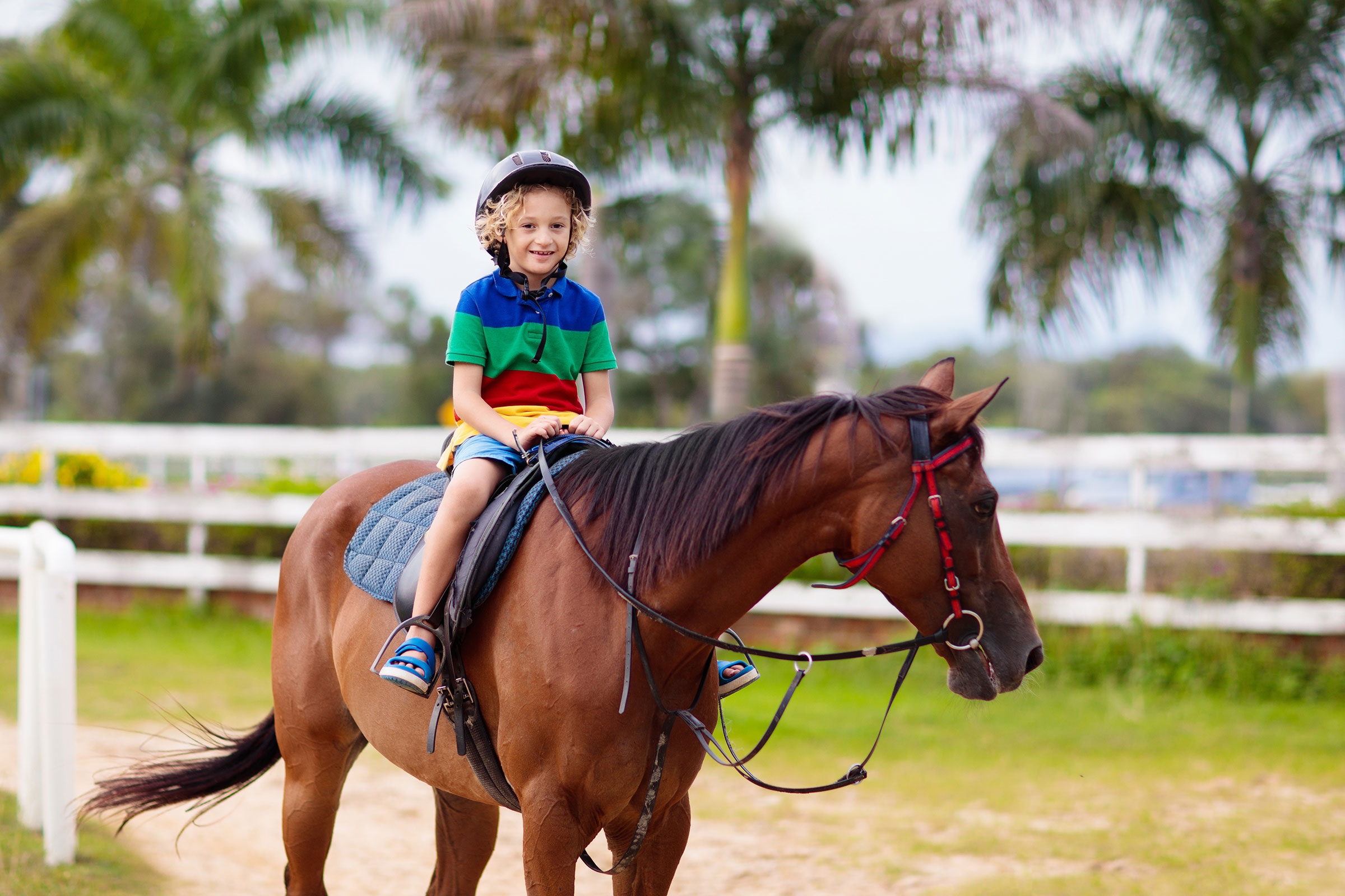 child riding on hose
