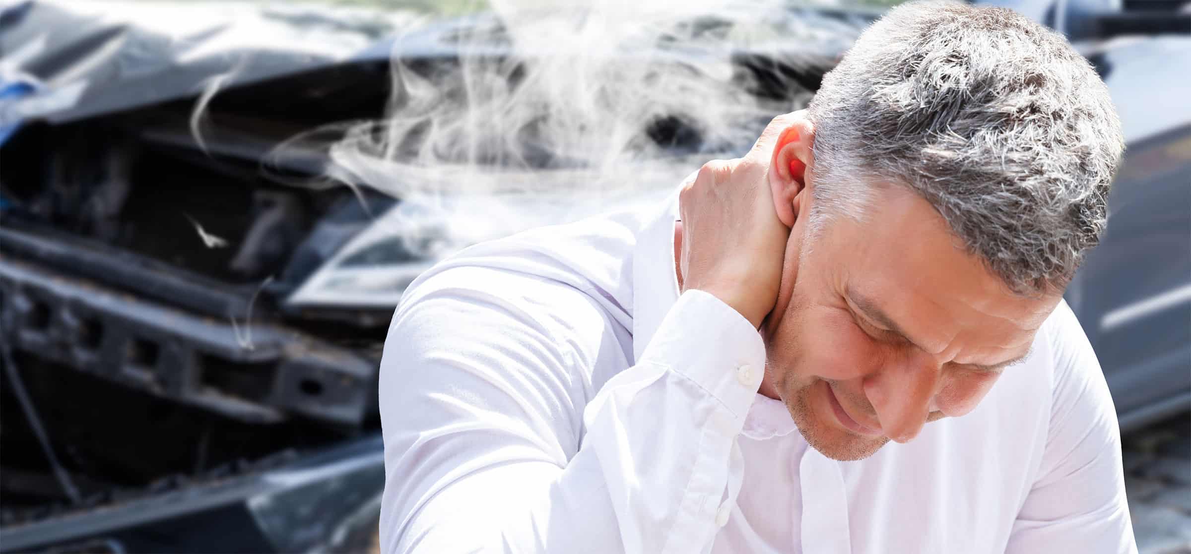 car crash victim man in white shirt holding neck