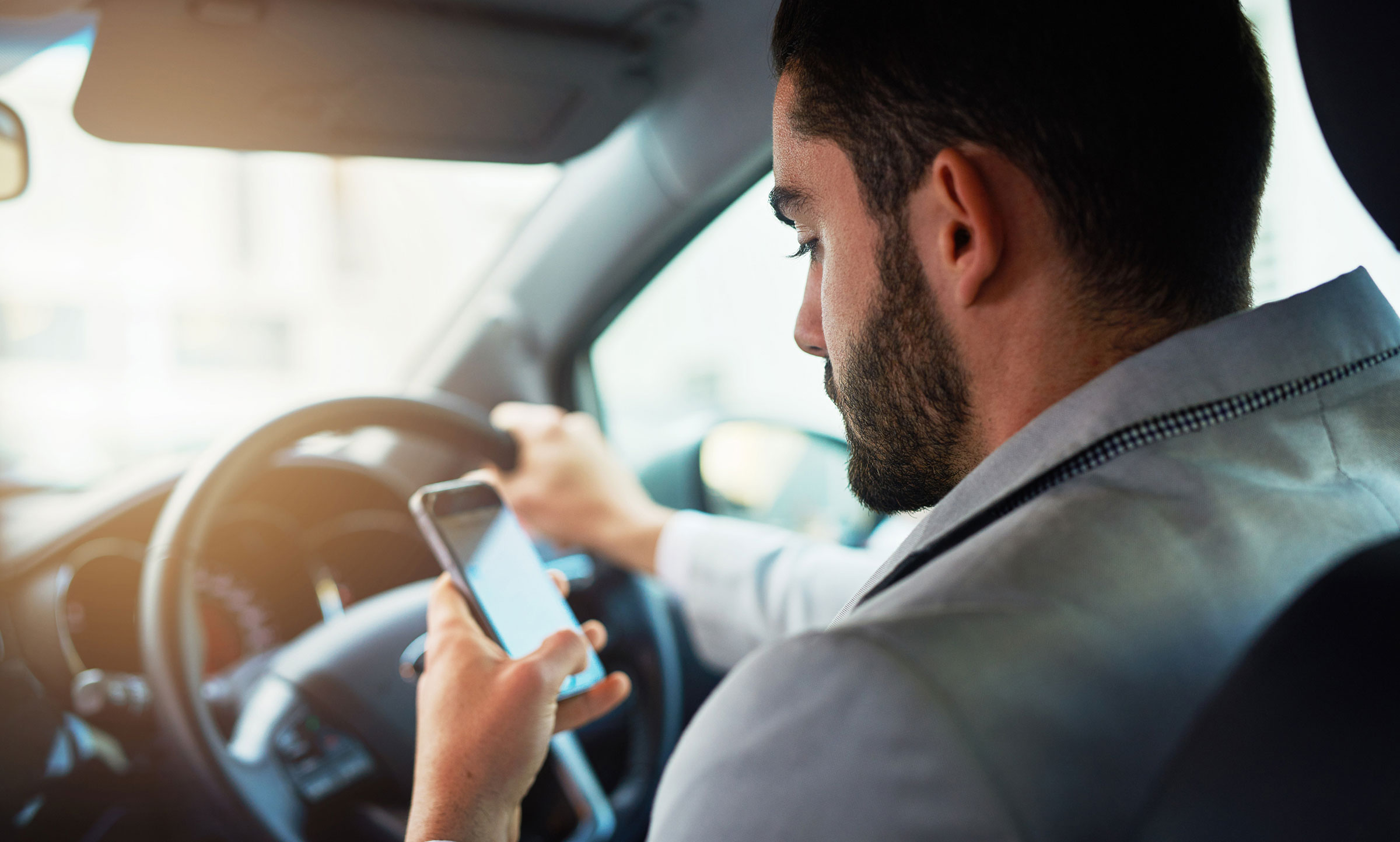 Distracted driver using cell phone