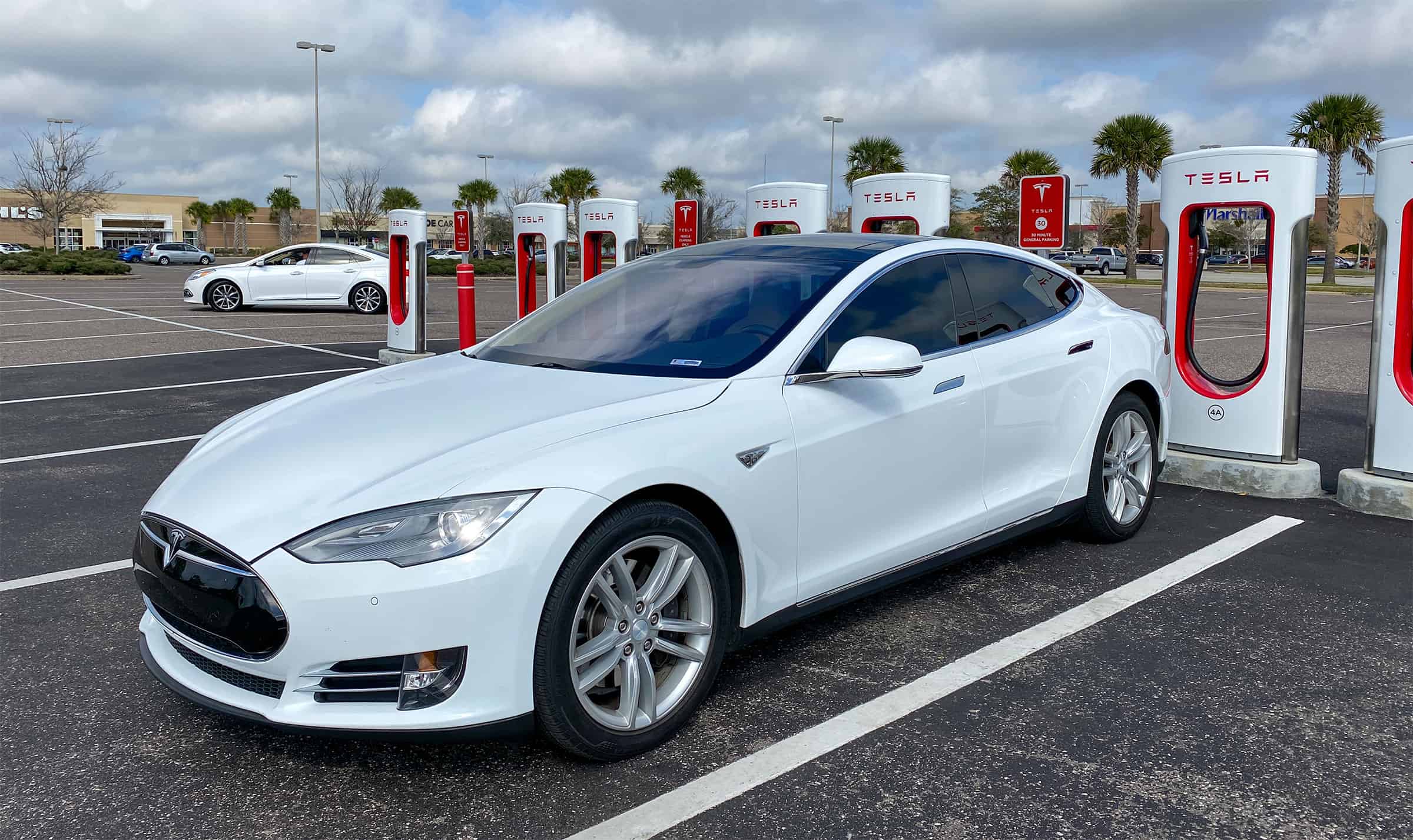tesla at a supercharger station in florida