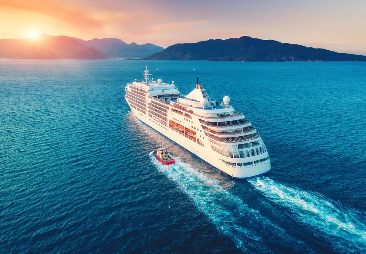 image - Cruise Ship At Harbor Arial View approaching islands with mountains