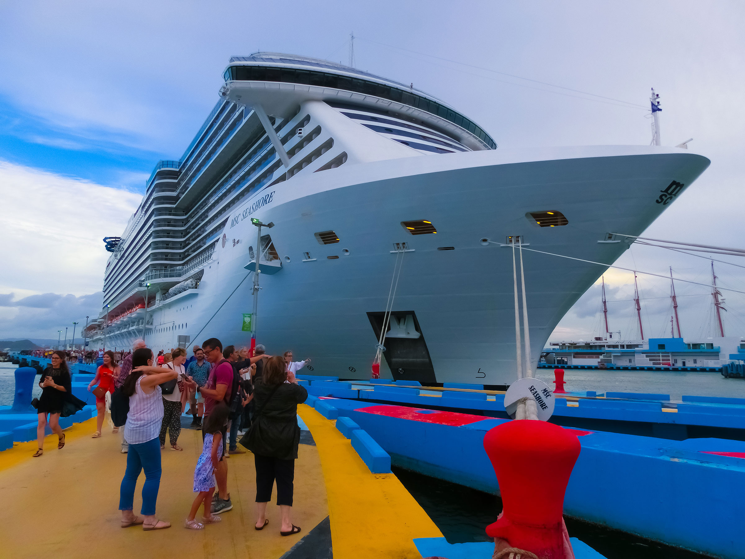 cruise ship at port with passengers sightseeing