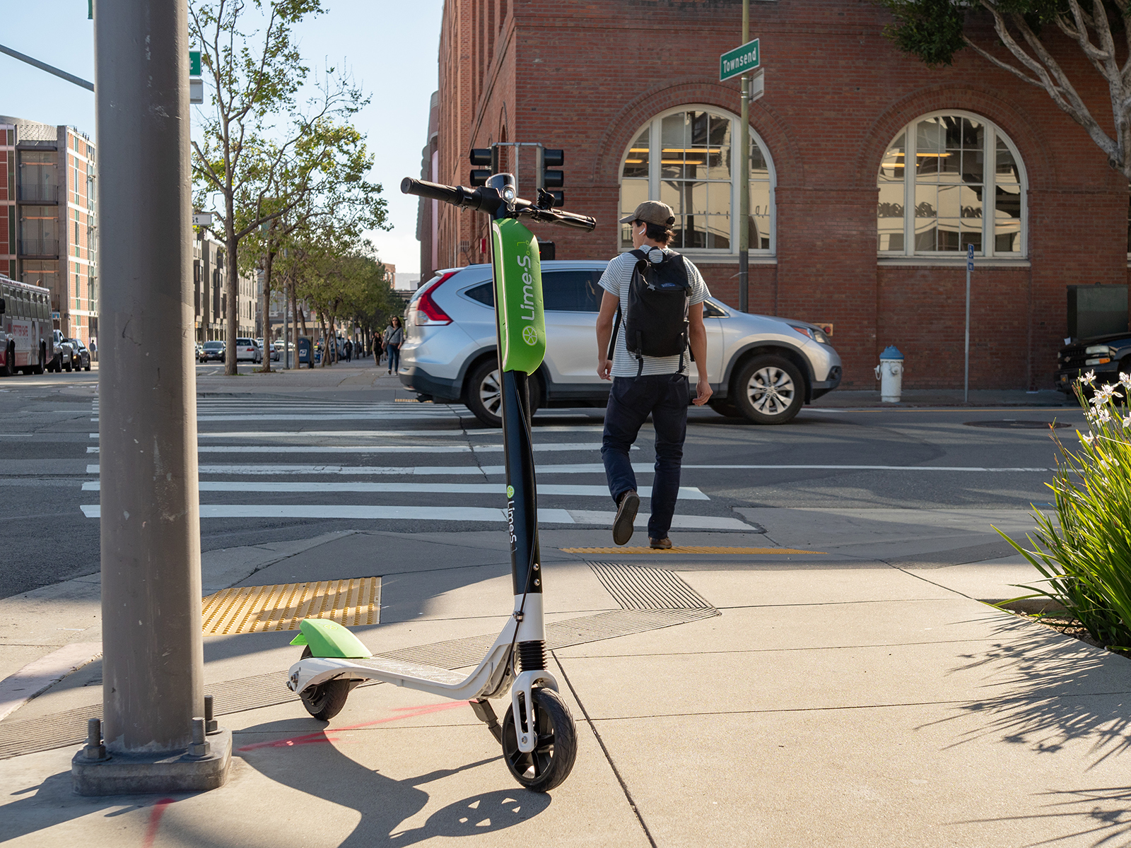 electric scooter parked on sidewalk downtown