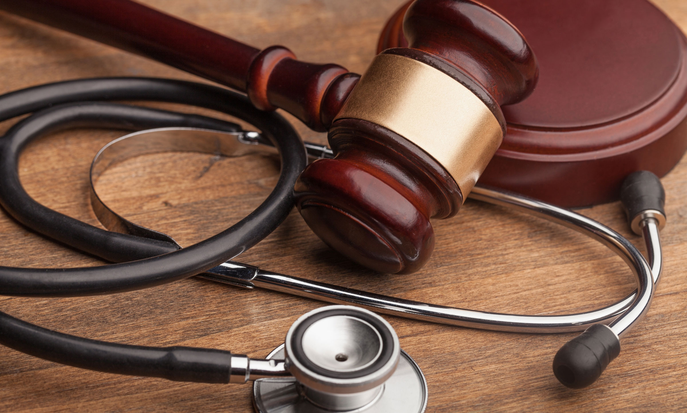 court gavel and stethascope graphic