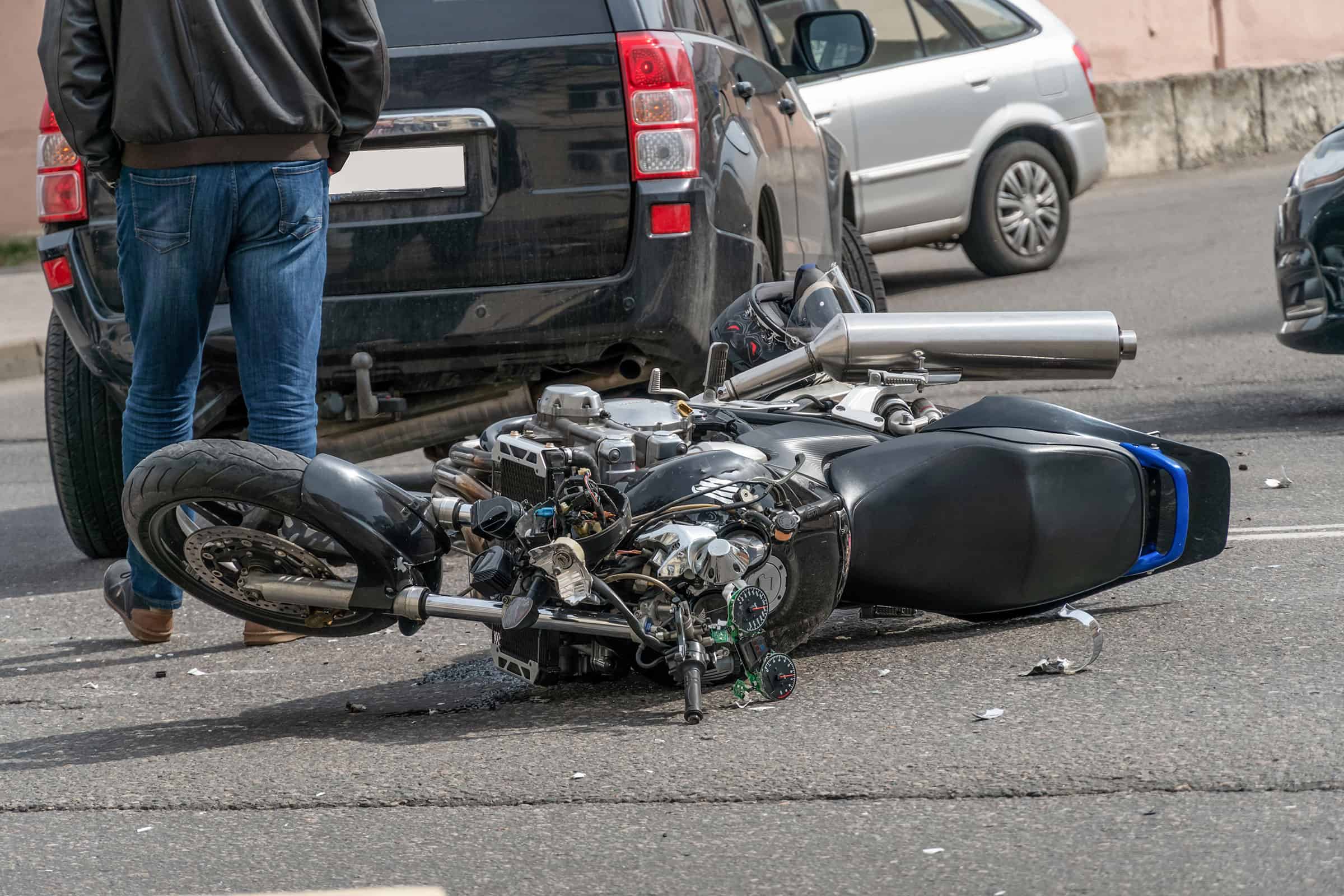 motorcycle accident rider standing near motorcycle