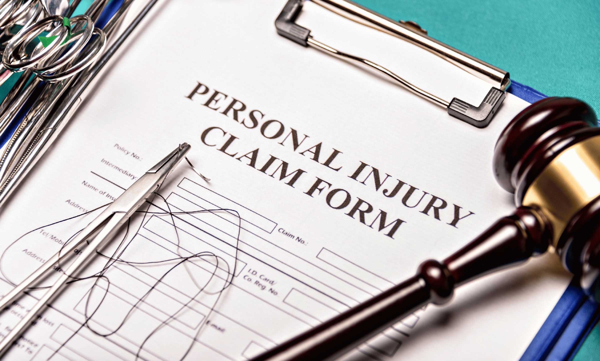 personal injury claims form with medical equipment and court gavel