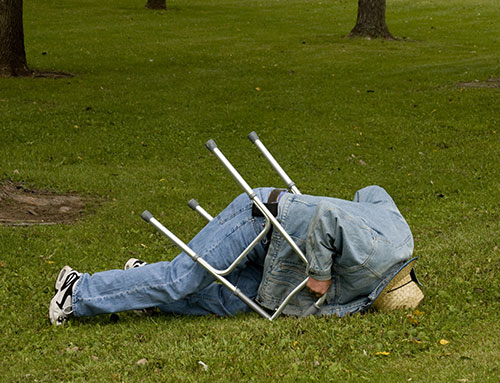 Man with walker tripped on hole in grass and fell face first into the grass