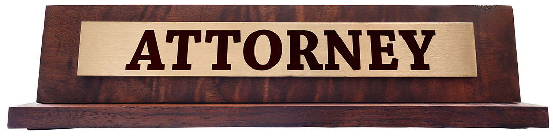 Wooden sign for desk with gold placque that says Attorney