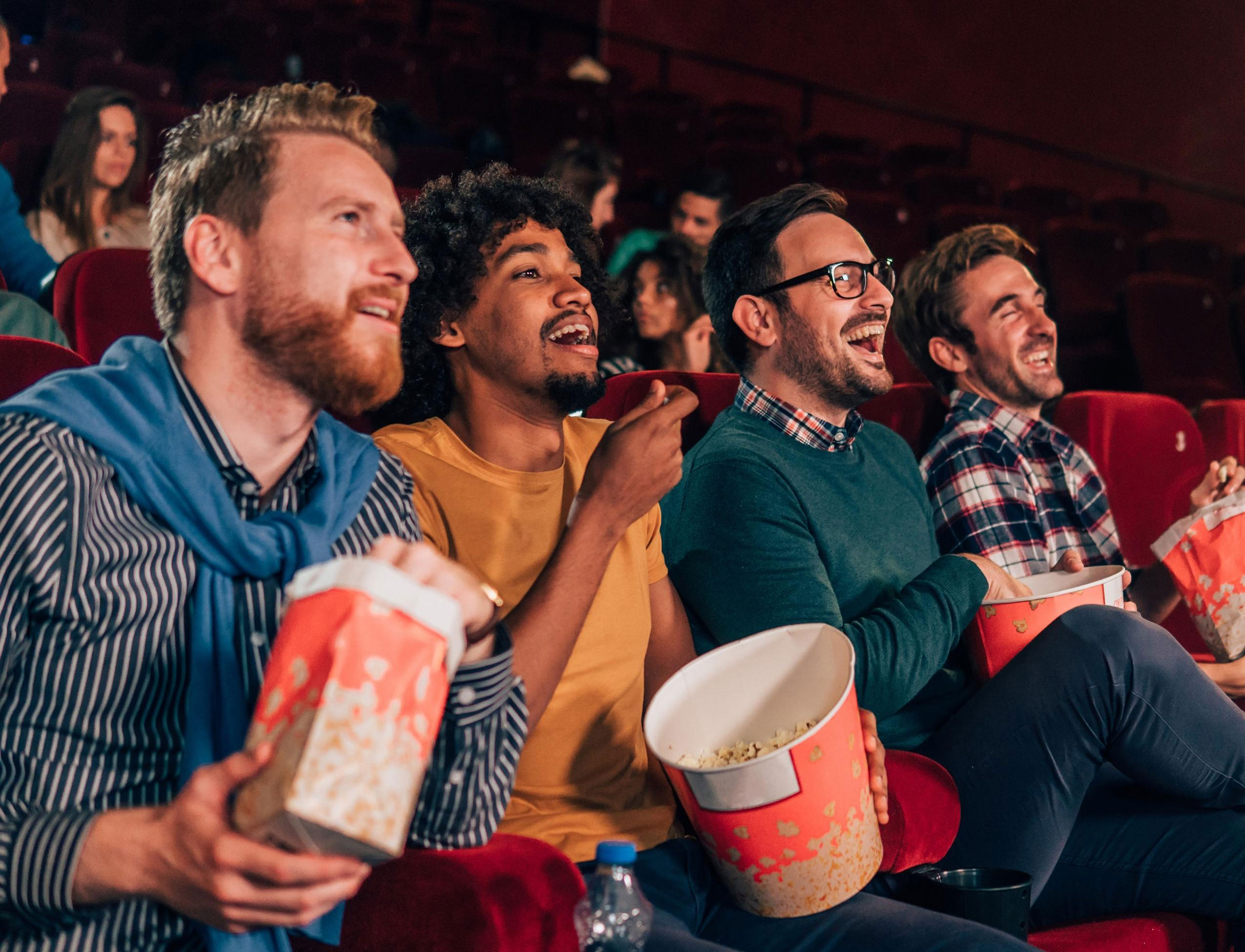 people watcing a movie in a movie theatre