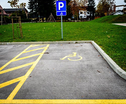 yellow lines in parking lot slippery when wet and could be responsible for a slip and fall personal injury accident.