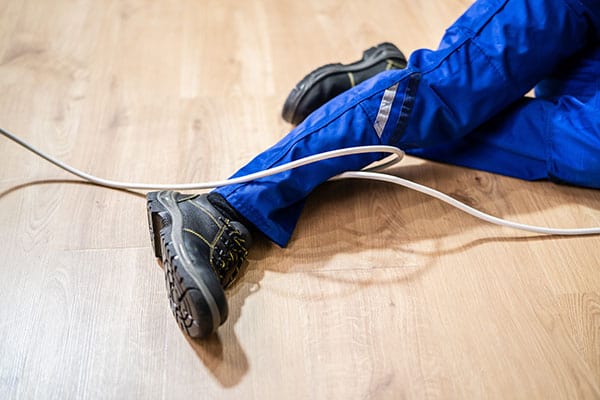 man on floor having tripped on a cable