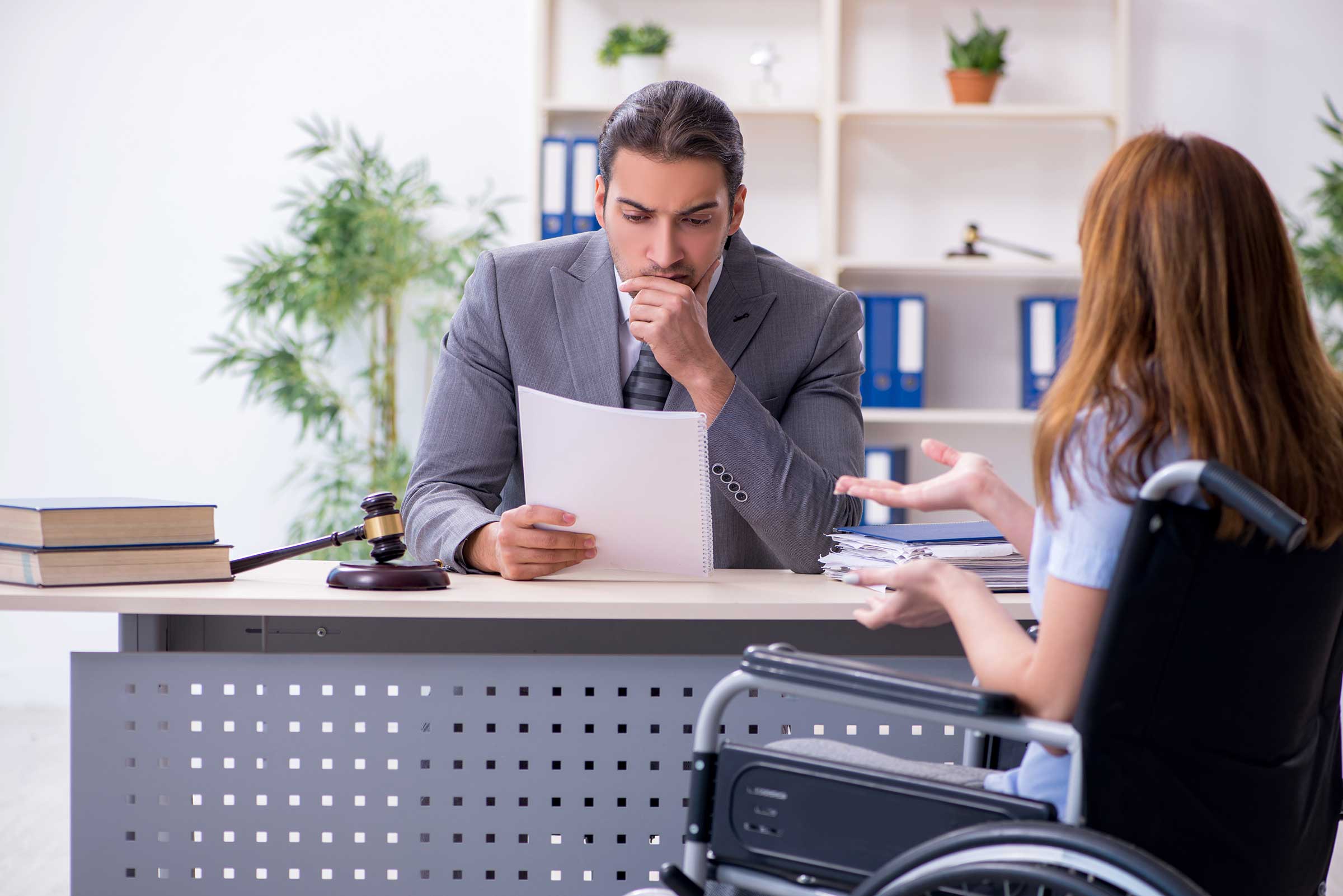 young injured woman talking with west palm beach injury lawyer